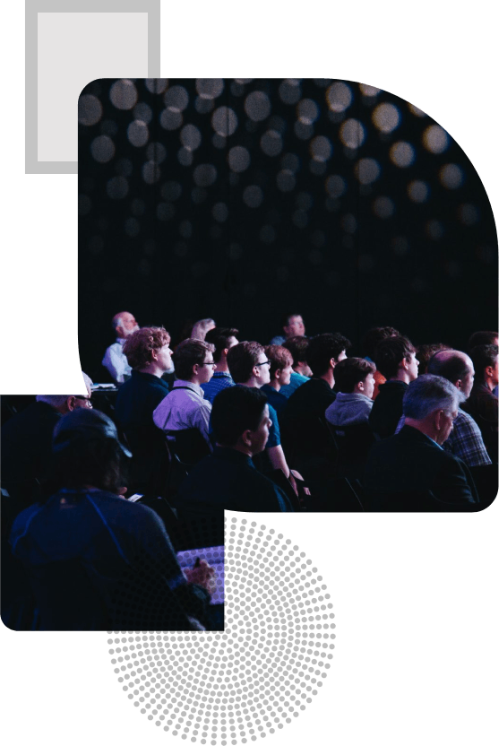 crowd of people sitting on chairs inside room